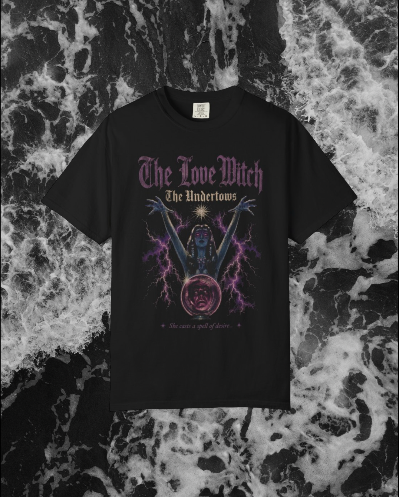 Black t-shirt with 'The Love Witch' vintage style graphic design on a textured black background